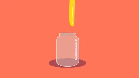 A glass jar filled with a yellow substance.
