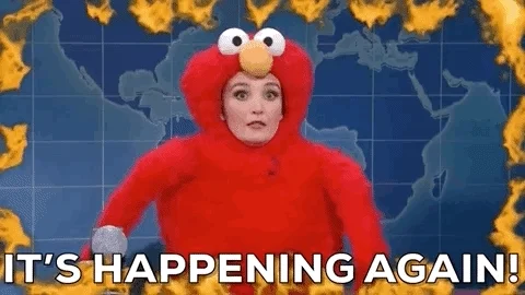 Woman on fire screaming, 'Ahhhhhhhh, it's happening again!' while wearing an Elmo costume.