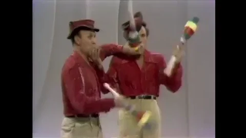 Two men juggling.