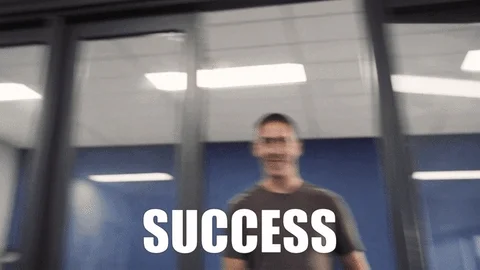 A man walks out of an office smiling with a thumbs up, and the word "Success" appears at the bottom.