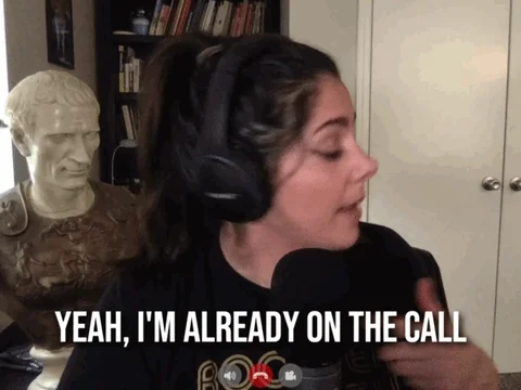 A student, wearing headphones, says, 