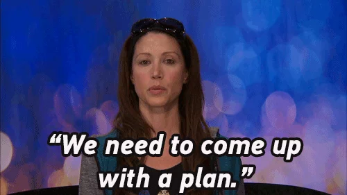 A woman looks straight at the camera and says 