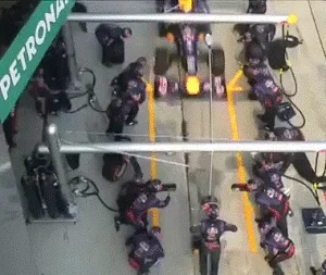A Formula 1 team refueling and changing tires in a matter of seconds.
