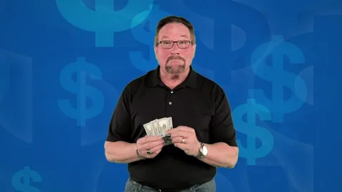 A man casually throwing dollar bills into the air.