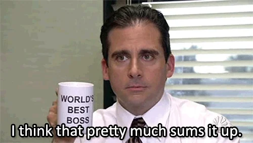 Michael Scott from The Office holding up his World's Best Boss mug and saying