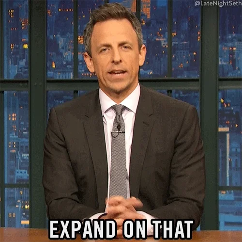 Seth Meyers prompting with his hand and saying, 