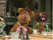 Fozzie Bear covers his eyes with his hand
