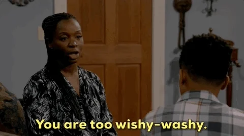 A person talking to someone saying, 'You are too wishy-washy.'