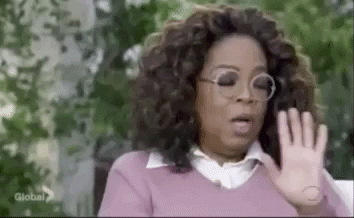 How to give negative feedback: Oprah moving her hands up and down in discomfort.