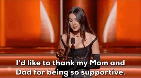 Olivia Rodrigo accepting a Grammy Award. She says, 