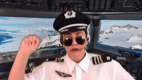 Female pilot dancing in the cockpit