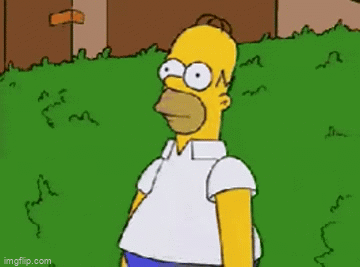Homer Simpson backs away into a bush.