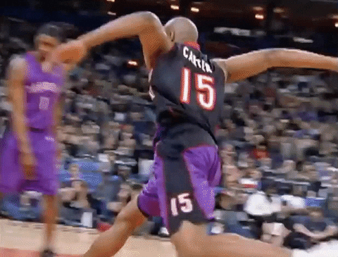 Vince Carter slam dunking a basketball