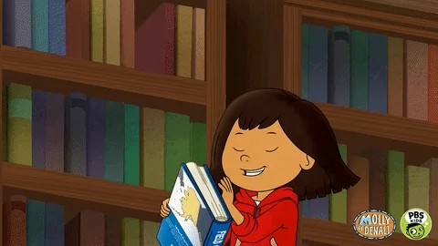 Cartoon character opening a book titled “Field Guide to Alaska.