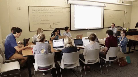  A timelapse of a group of students in a classroom working on activities together.