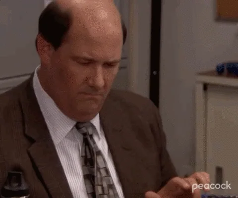 Kevin from The Office using two calculators at the same time.