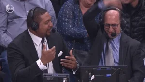 Two NBA commentators making hand gestures.