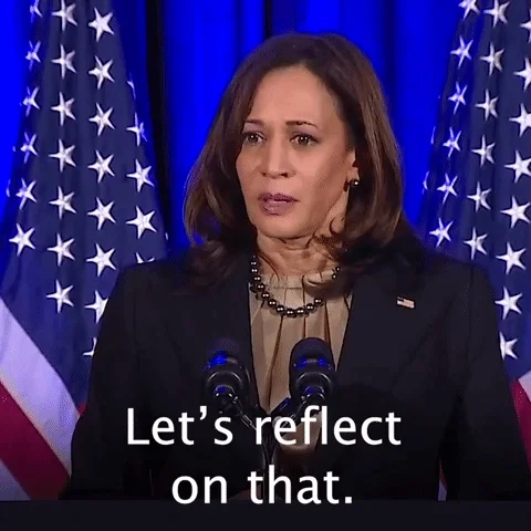Kamala Harris in front of the American flag saying, 