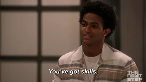 A young man shrugs his shoulders and says, "You've got skills."