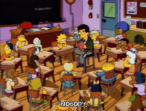 A teacher reading a story for a class of kids.