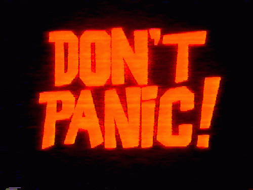 Flashing neon text 'Don't panic.'