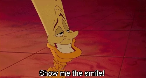 The Beast from Beauty and the Beast smiling widely, showing crooked teeth. Lumiere telling him to, 'show me the smile.'