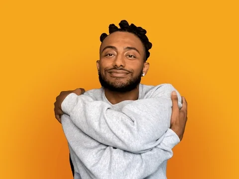 A person giving themselves a hug