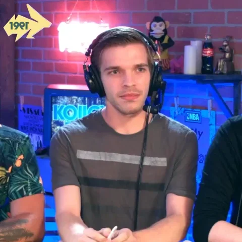A podcaster putting up his hand asking, 