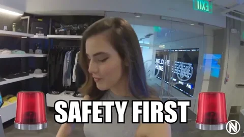 A woman in an office saying 'Safety first.'