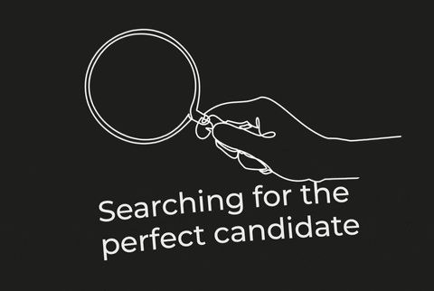 A magnifying glass. The text reads: Searching for the perfect candidate.