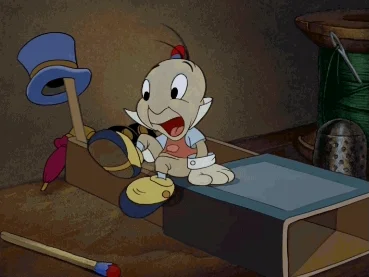 A GIF of Jiminy Cricket getting into bed for the night. 