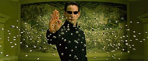 Keanu Reaves in the Matrix using a forcefield to dodge bullets.