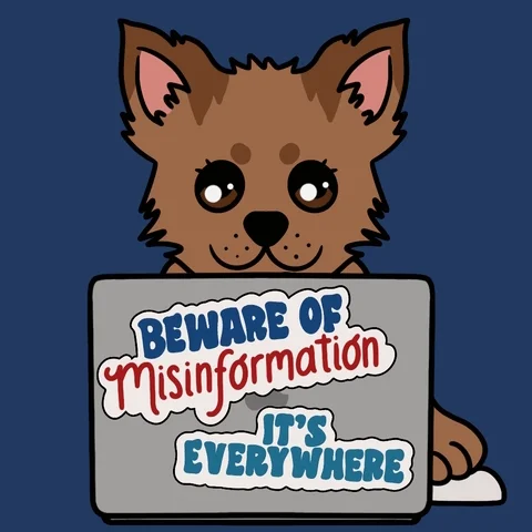 A dog behind a computer with the sticker, 