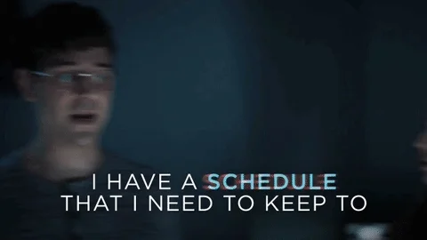 A man standing in the dark saying, 'I have a schedule that I need to keep to.'