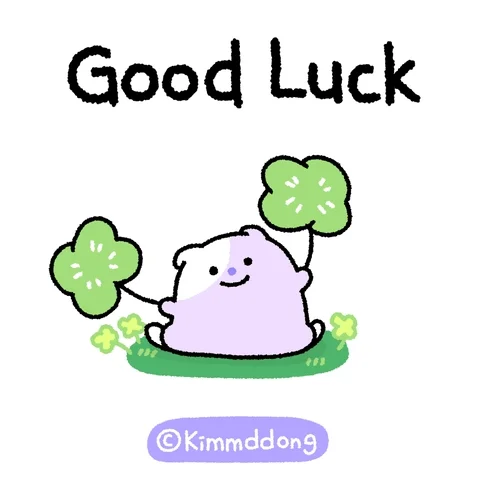A little bear is waving two lucky clovers and saying, “Good luck!”