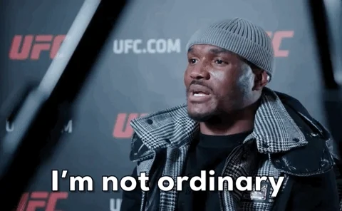 A man looks ahead while speaking, with on‑screen text that changes from “I’m not ordinary” to “I’m extraordinary.”