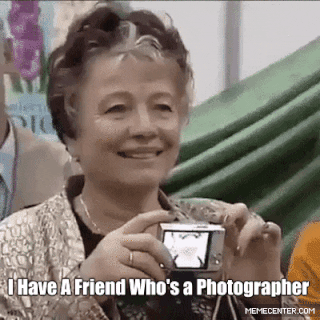 Woman unknowingly taking a photo of herself with a camera instead of the person she intended to take photo of.