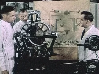 Scientists working on a nuclear fission machine.