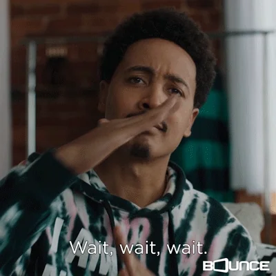 A man says "Wait, wait, wait! Time out!" while making a "T" symbol with his hands.