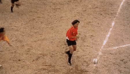 Football players doing impossible tricks on a pitch