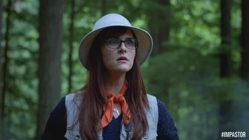 Excited woman looking through binoculars.