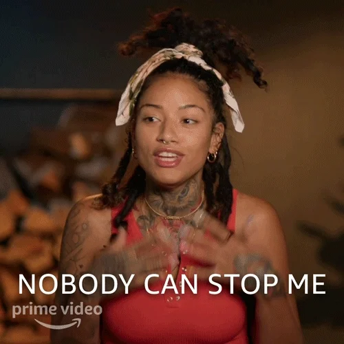 A young person confidently tossing their hair aside. They say, 
