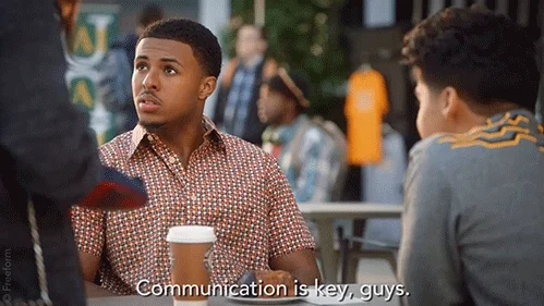 Young man telling his friends, 'Communication is key, guys.'