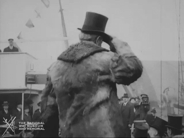 Newsreel footage of President Woodrow Wilson greeting a crowd beside a ship.