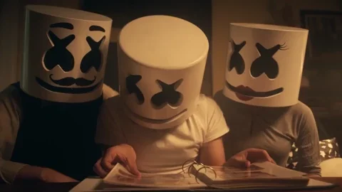 A family with marshmallow heads looking at a photo album.