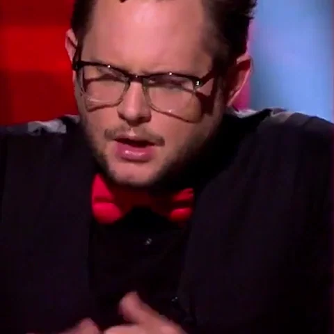 A man moves his hands to his face in disappointment.