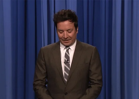 Jimmy Fallon on stage pretending to text  and saying 