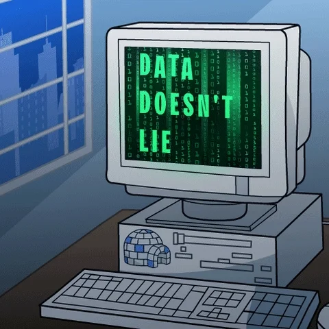 A computer from the early 90s with green text on the screen that says, 