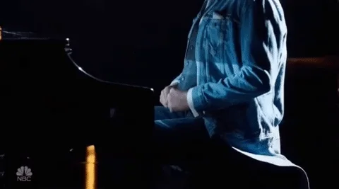 A concert pianist stretching his fingers.