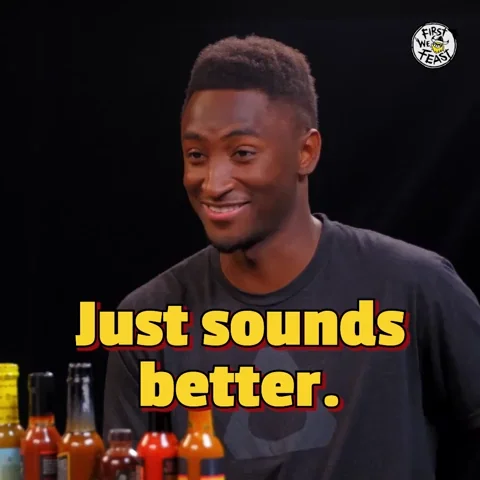 A man smiles and says, 